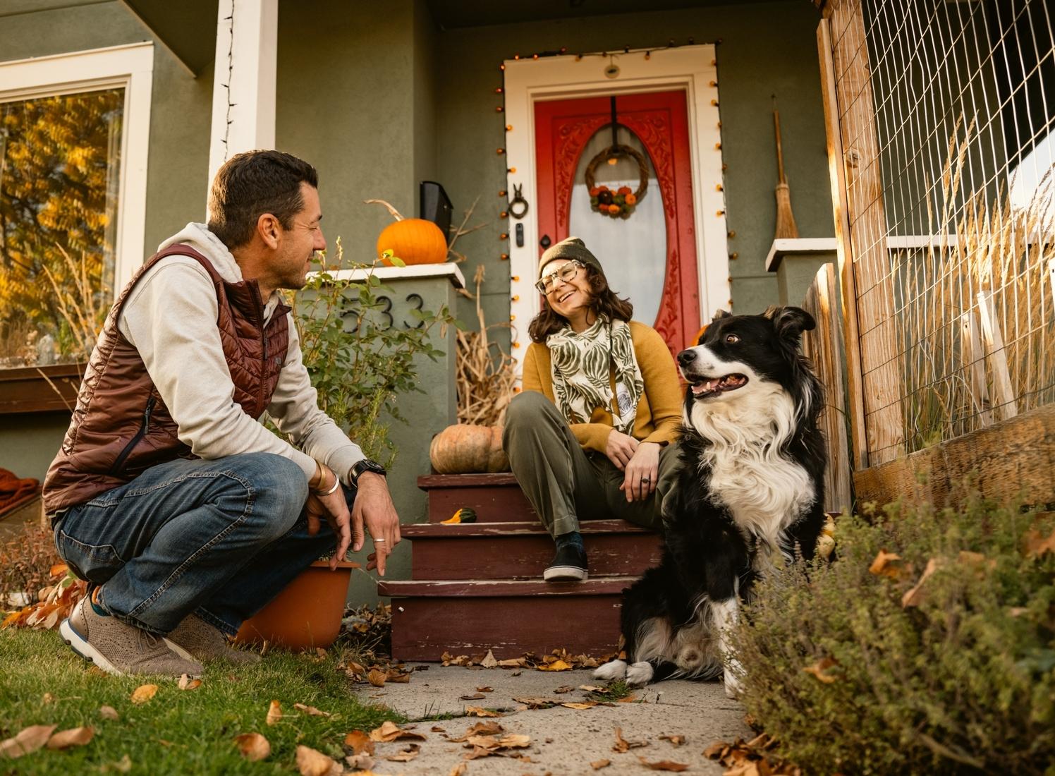 People on porch with dog