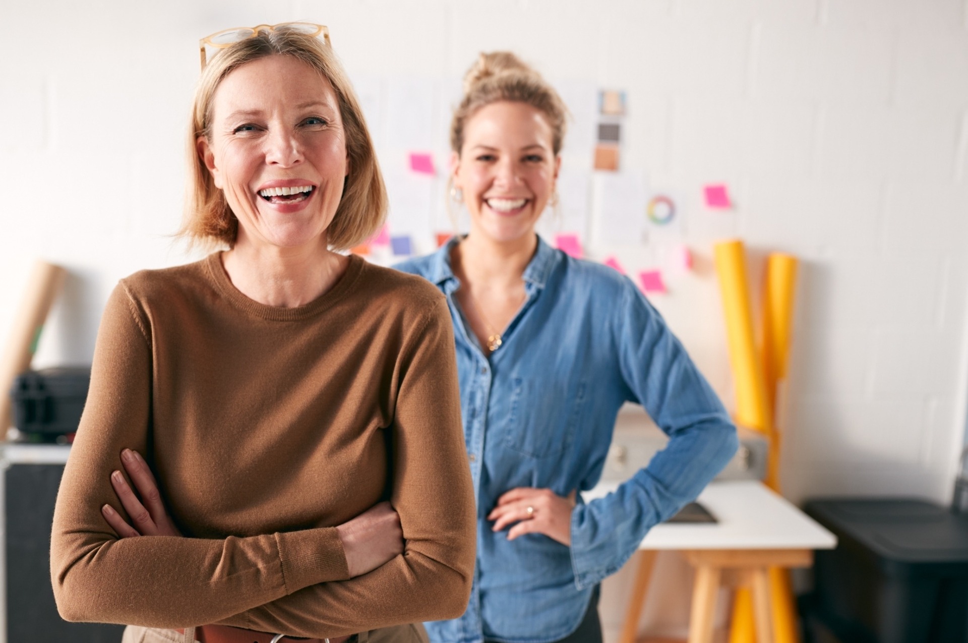 two women standing in office